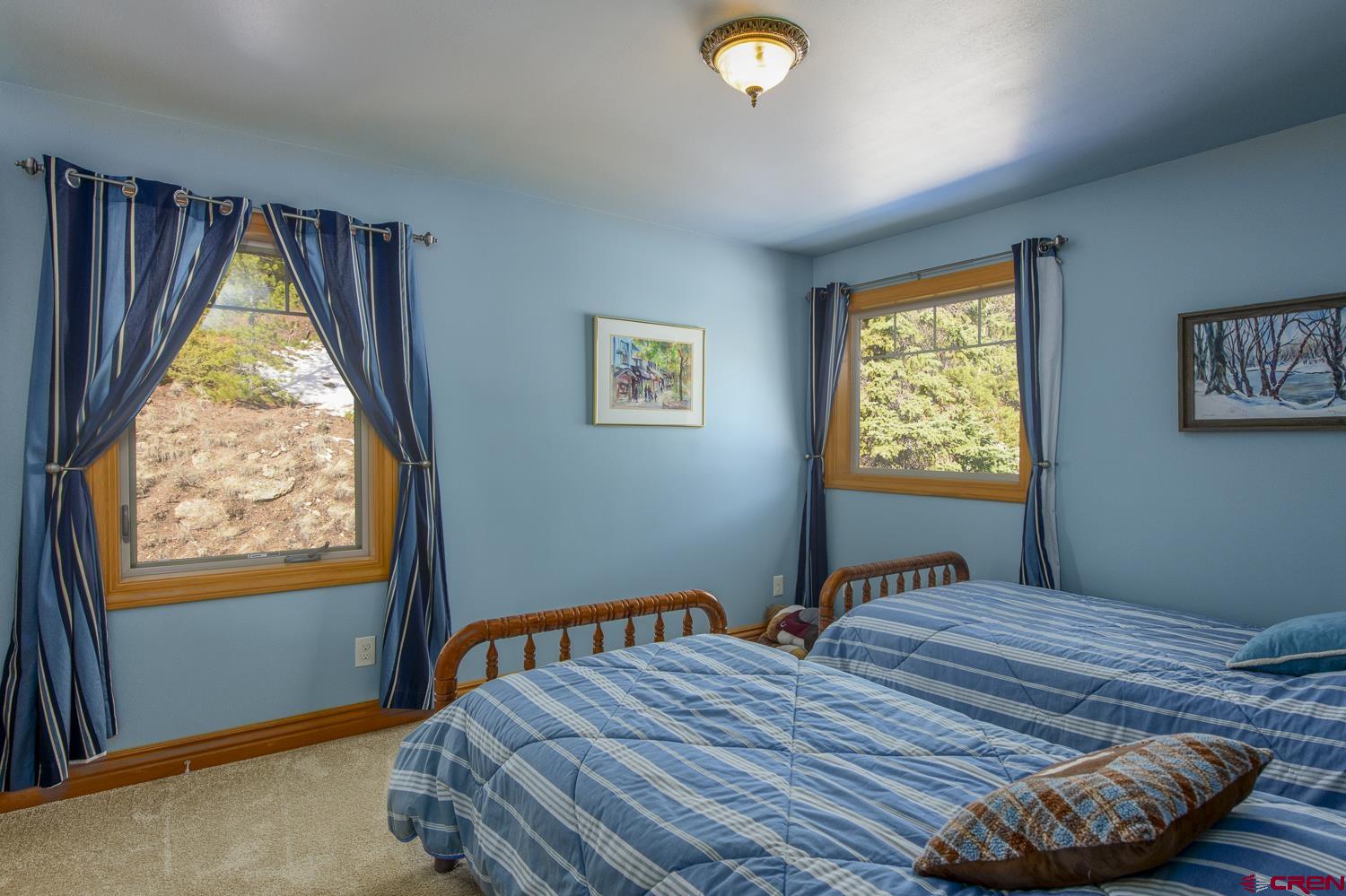 825-823 Main Street Pitkin, CO 81241 - Photo 28 of 42 a bedroom with bed and a window