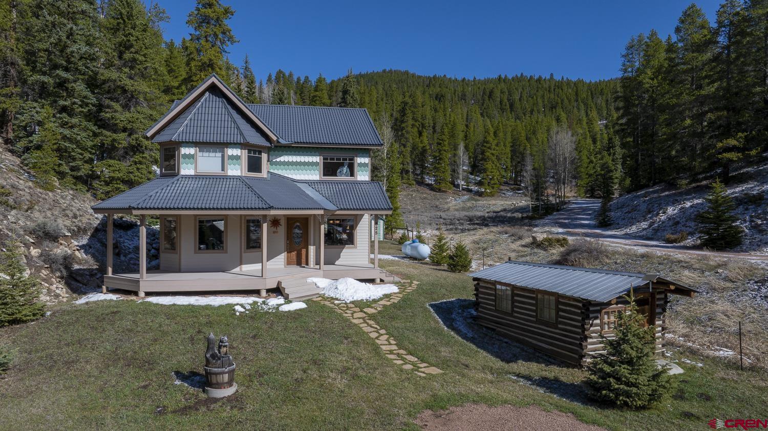 825-823 Main Street Pitkin, CO 81241 - Photo 3 of 42 a front view of a house with garden