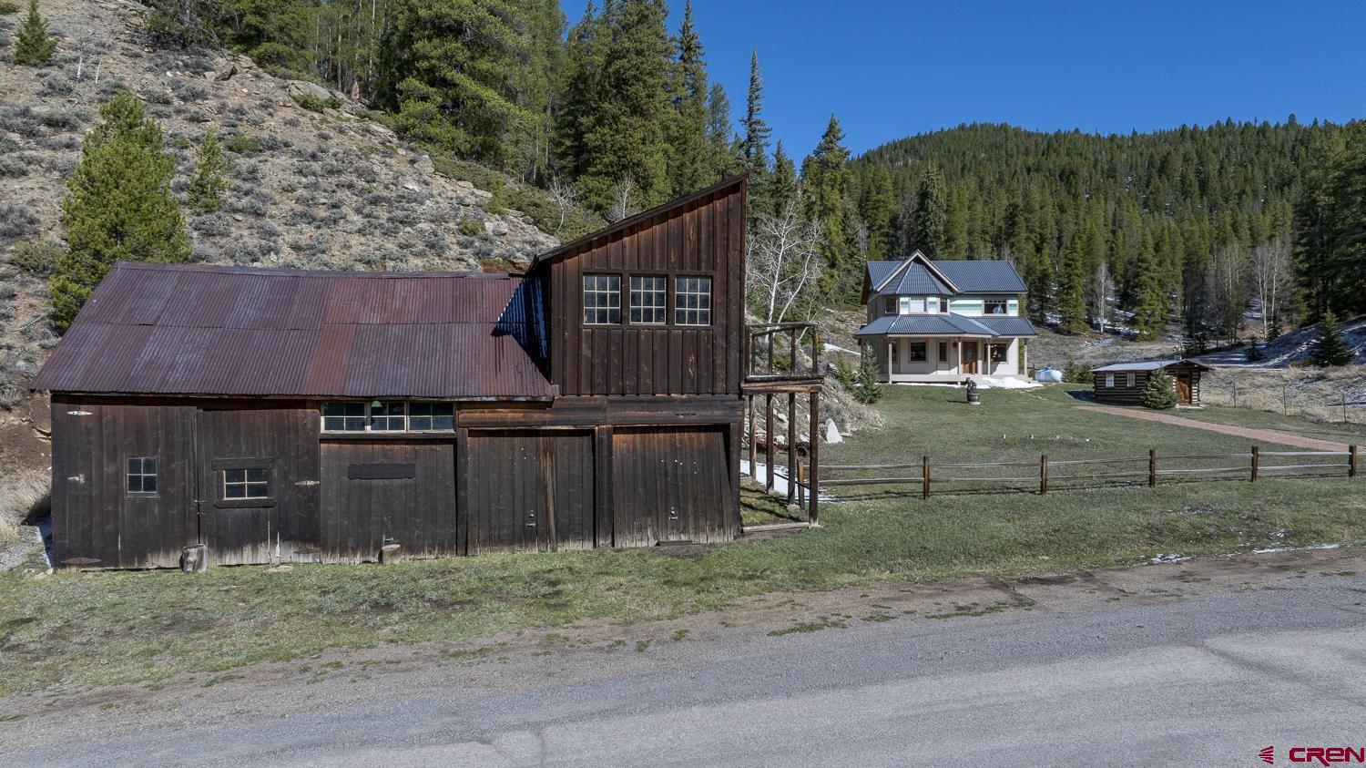 825-823 Main Street Pitkin, CO 81241 - Photo 40 of 42 a view of a house with a yard and wooden fence