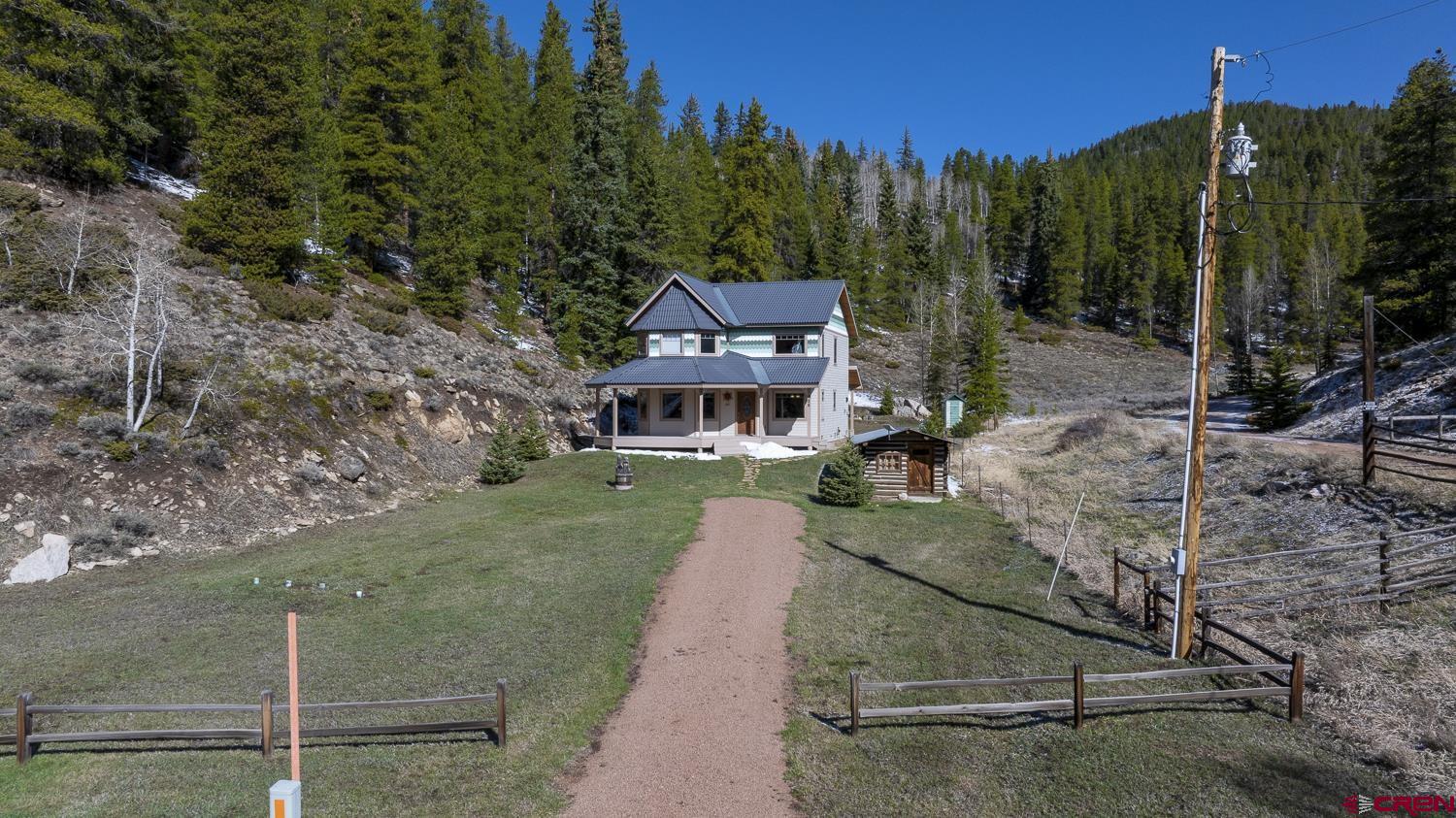 825-823 Main Street Pitkin, CO 81241 - Photo 5 of 42 a aerial view of a house with a yard