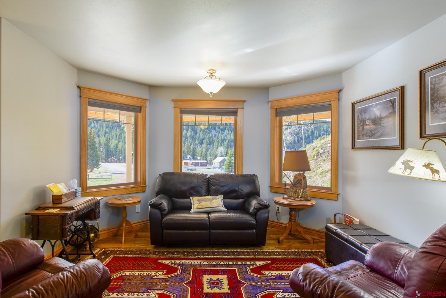 825-823 Main Street Pitkin, CO 81241 - Photo 6 of 42 a living room with furniture and a window