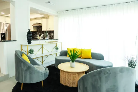 a living room with furniture and a table