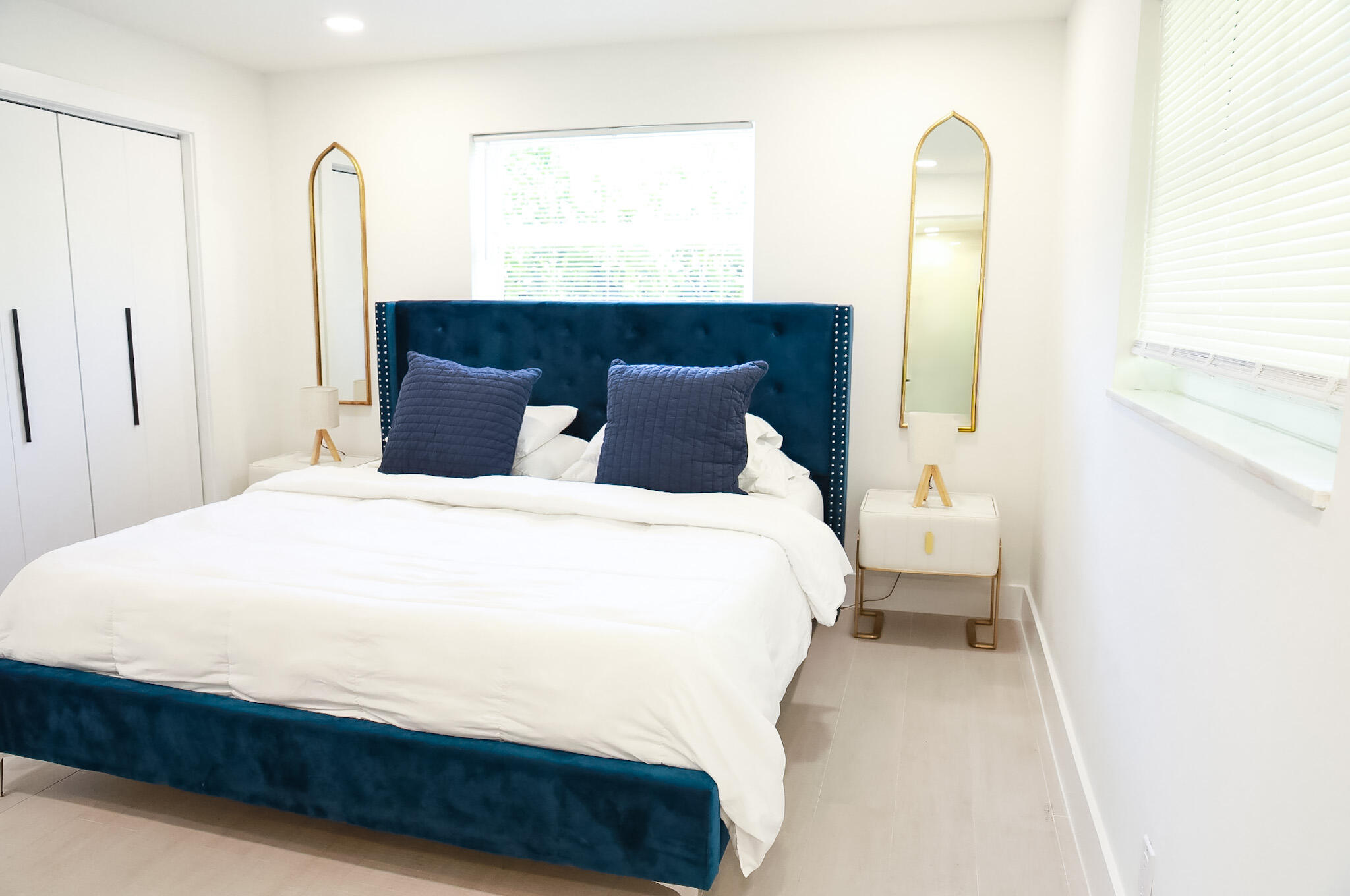 1502 Northwest 4th Avenue Delray Beach, FL 33444 - Photo 15 of 28 a bedroom with a bed and a mirror