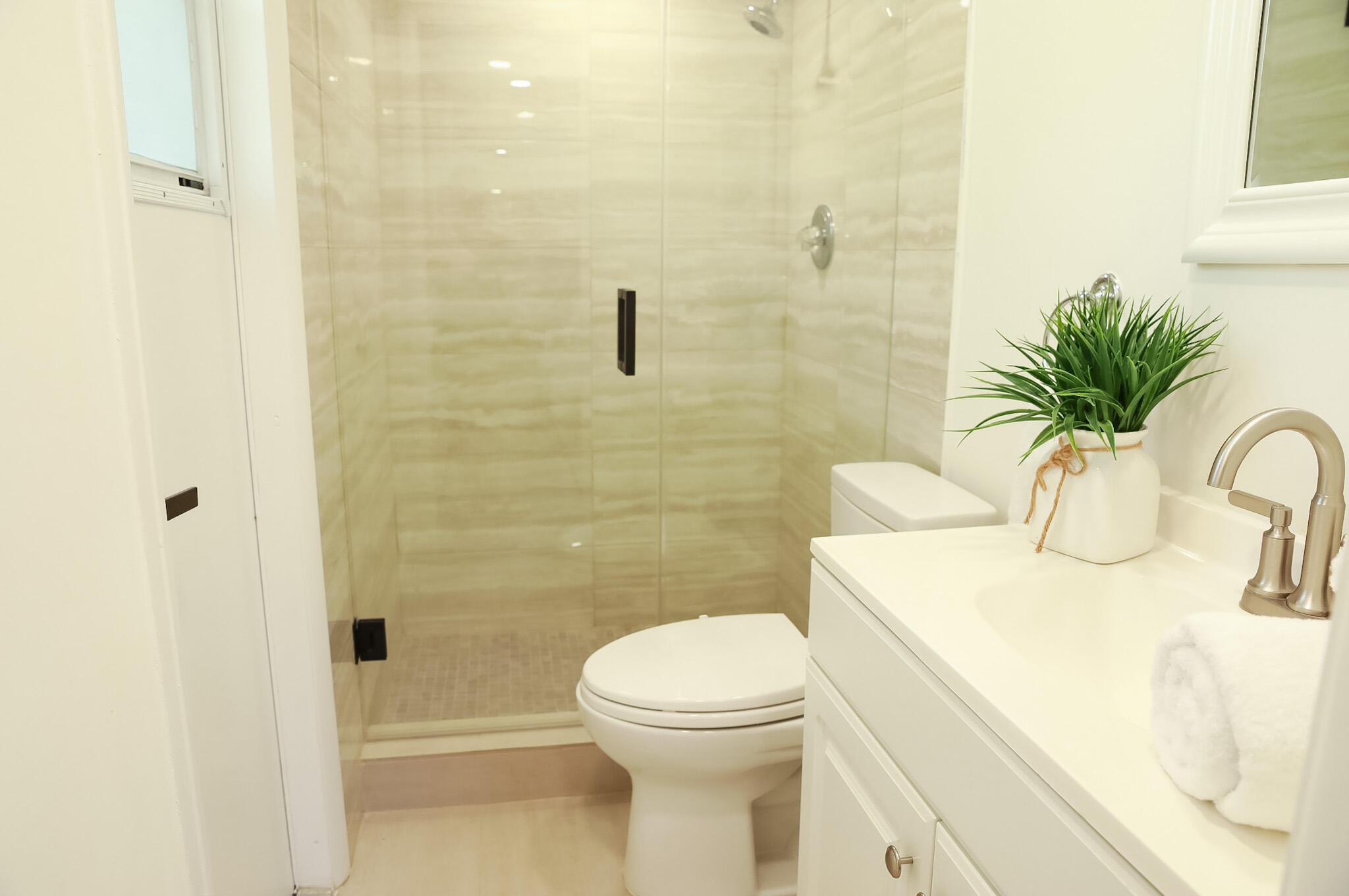 1502 Northwest 4th Avenue Delray Beach, FL 33444 - Photo 16 of 28 a bathroom with a sink a toilet and shower