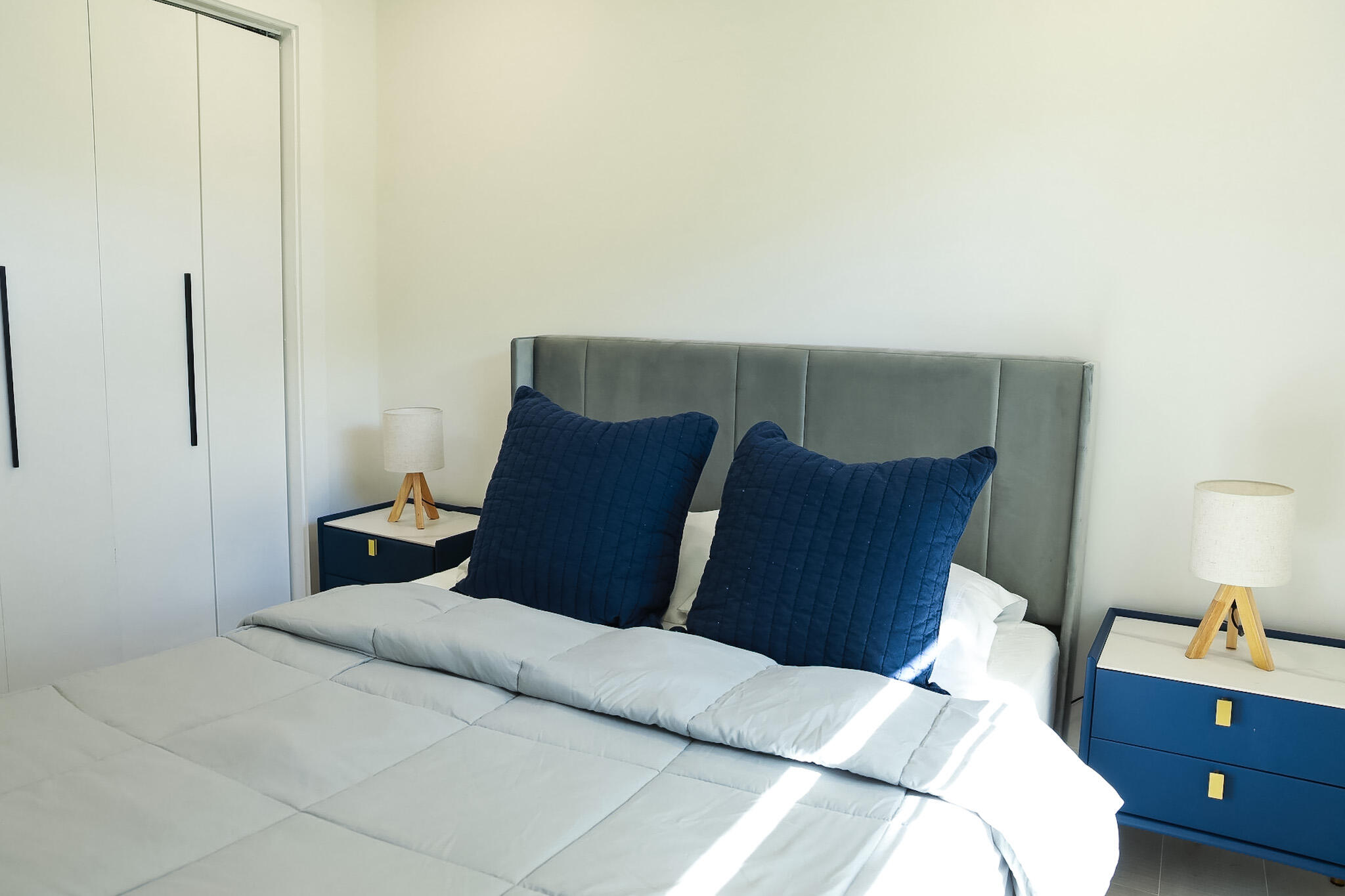 1502 Northwest 4th Avenue Delray Beach, FL 33444 - Photo 21 of 28 a bedroom with a bed and wooden floor