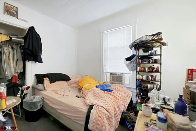 a bedroom with a bed and a fireplace