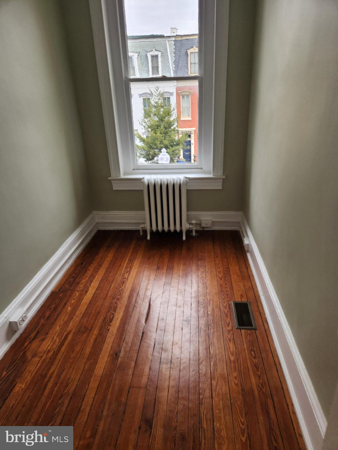 323 2nd Street Southeast Washington, DC 20003 - Photo 12 of 16 an empty room with wooden floor and windows