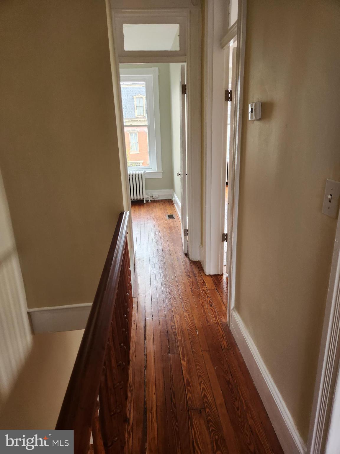 323 2nd Street Southeast Washington, DC 20003 - Photo 14 of 16 a view of a hallway with wooden floor and staircase