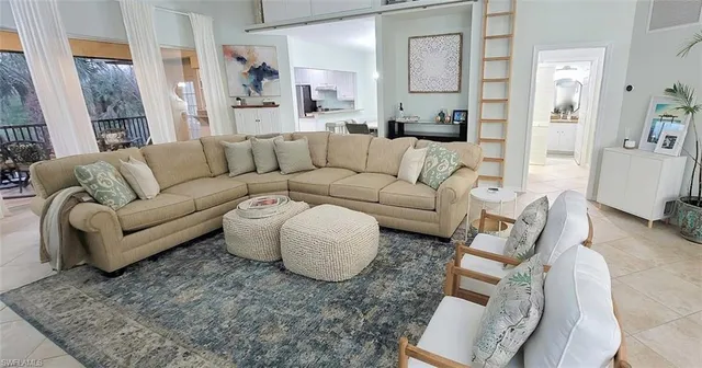 a living room with furniture and a couch