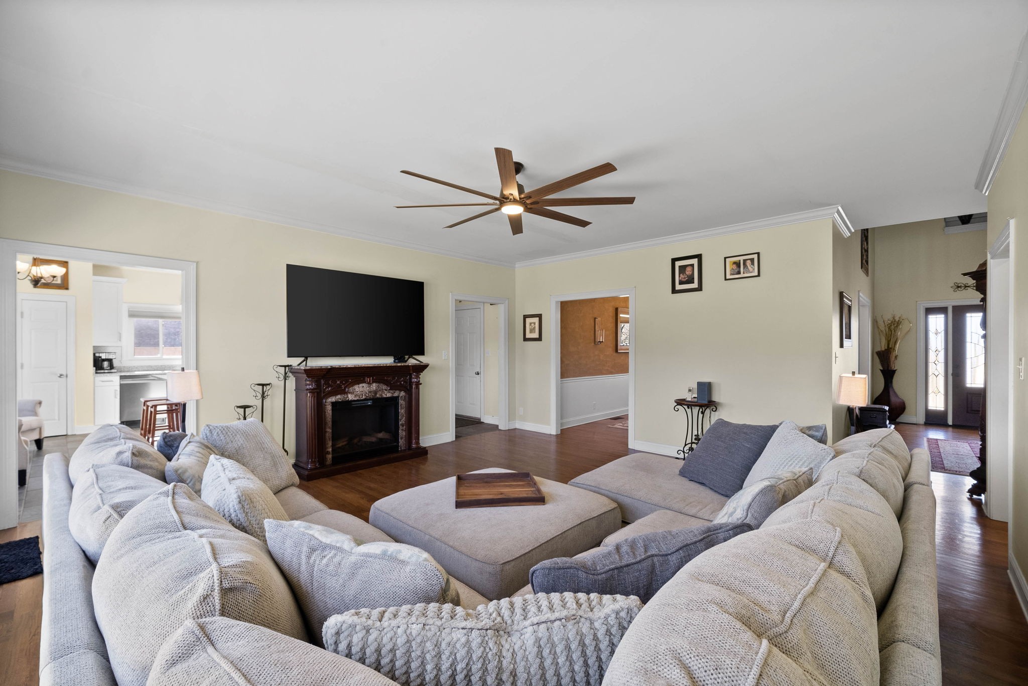 4787 Sango Road Clarksville, TN 37043 - Photo 12 of 55 a living room with furniture a flat screen tv and a fireplace