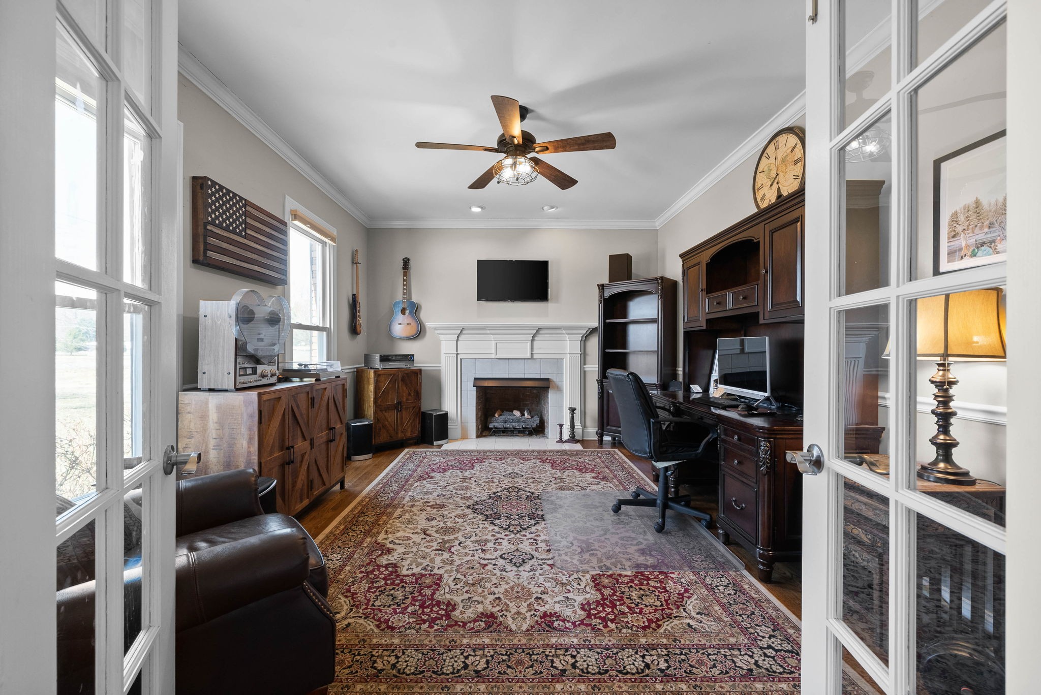 4787 Sango Road Clarksville, TN 37043 - Photo 32 of 55 a living room with furniture a flat screen tv and a fireplace