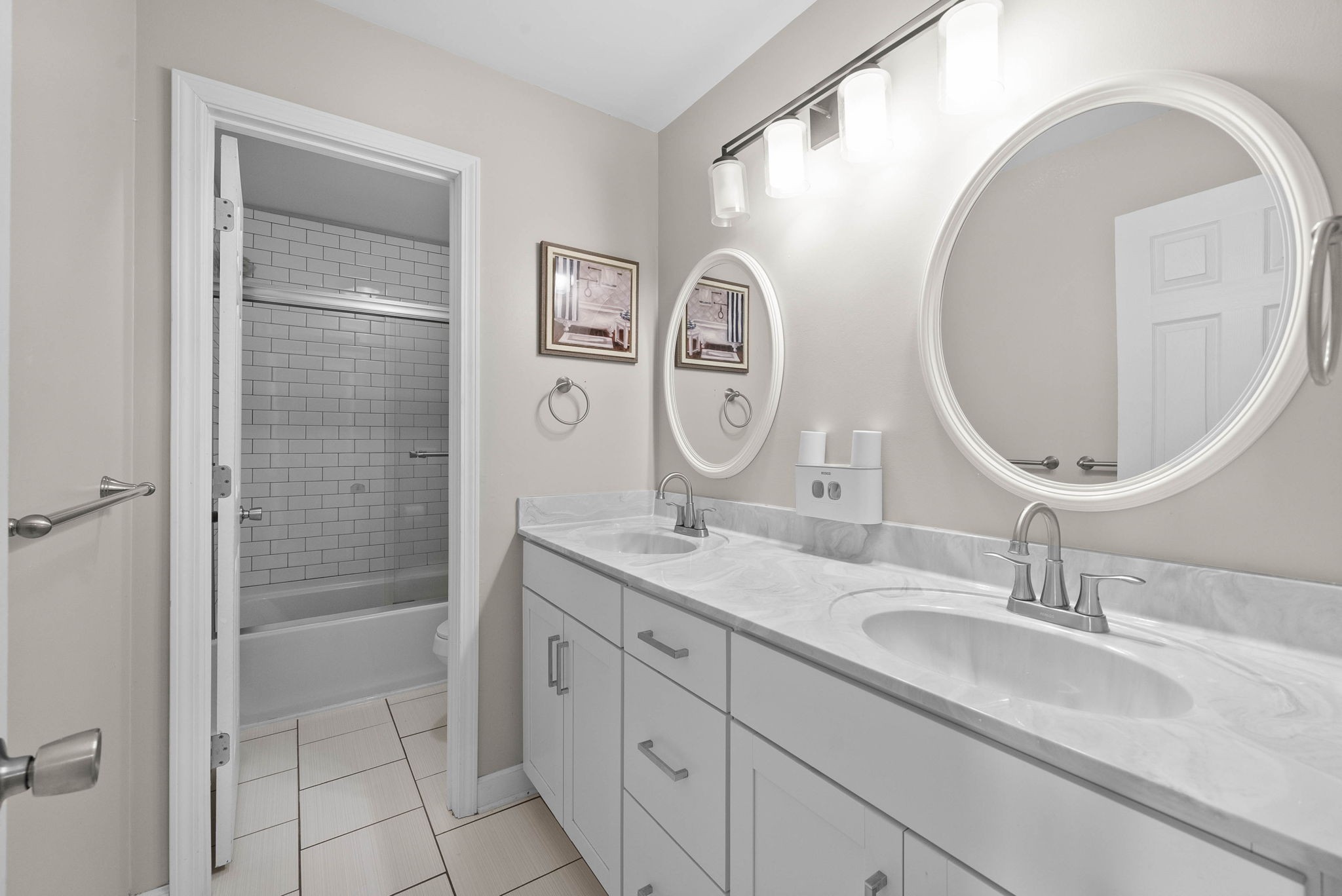 4787 Sango Road Clarksville, TN 37043 - Photo 42 of 55 a bathroom with a double vanity sink and a mirror