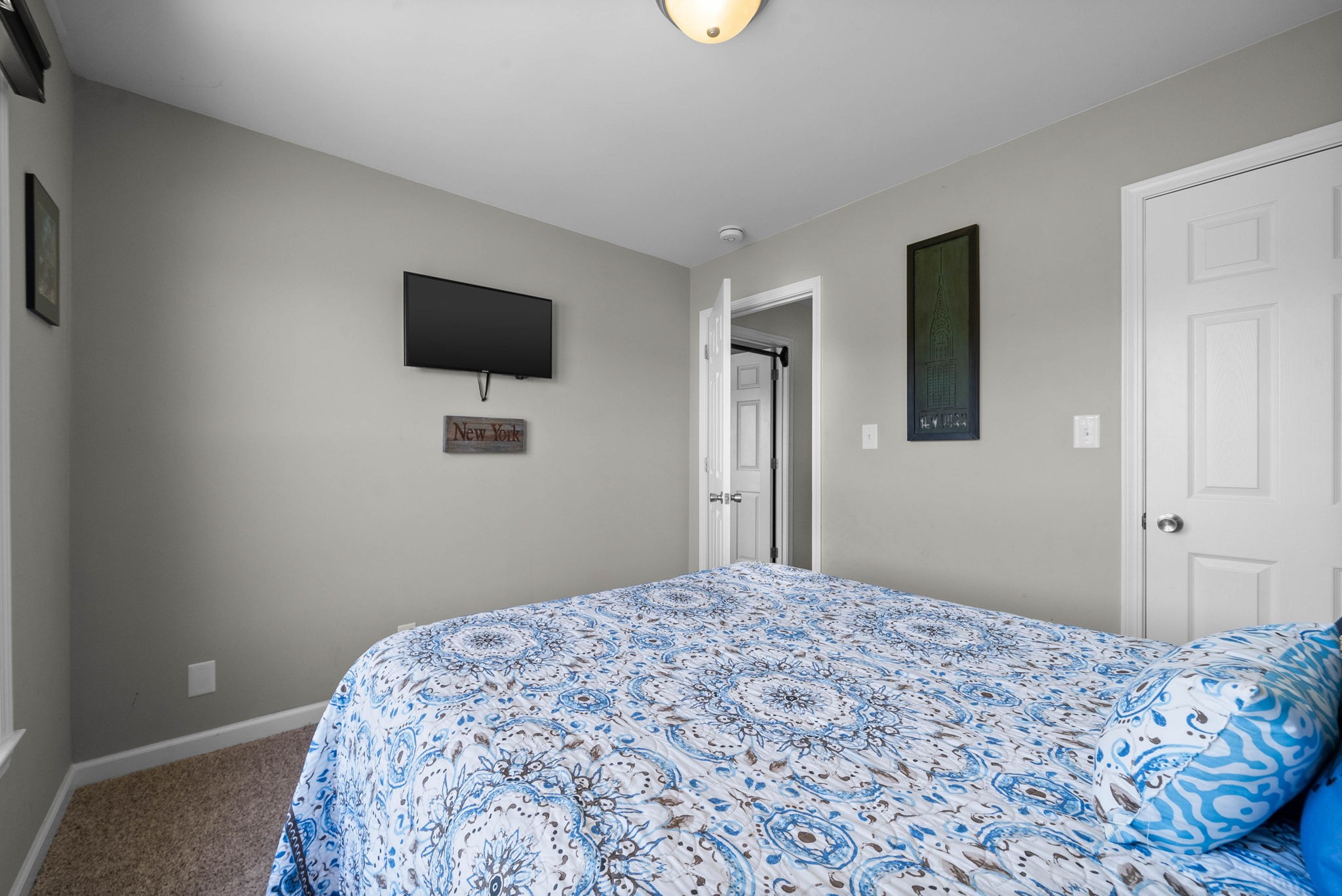 4787 Sango Road Clarksville, TN 37043 - Photo 47 of 55 a bedroom with a bed and a flat screen tv