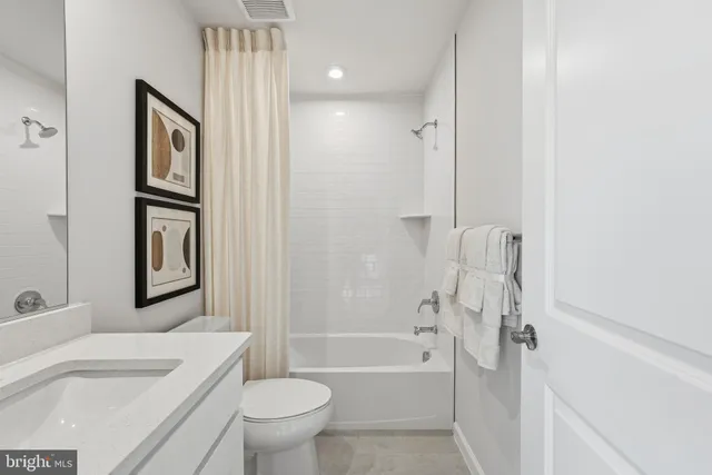 a bathroom with a toilet sink and bathtub