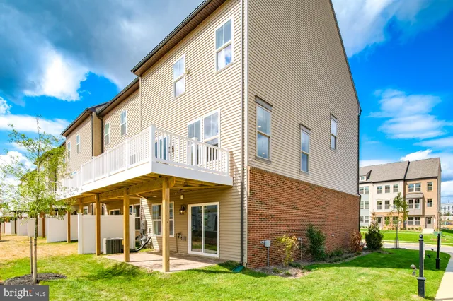 a view of a large building with a yard
