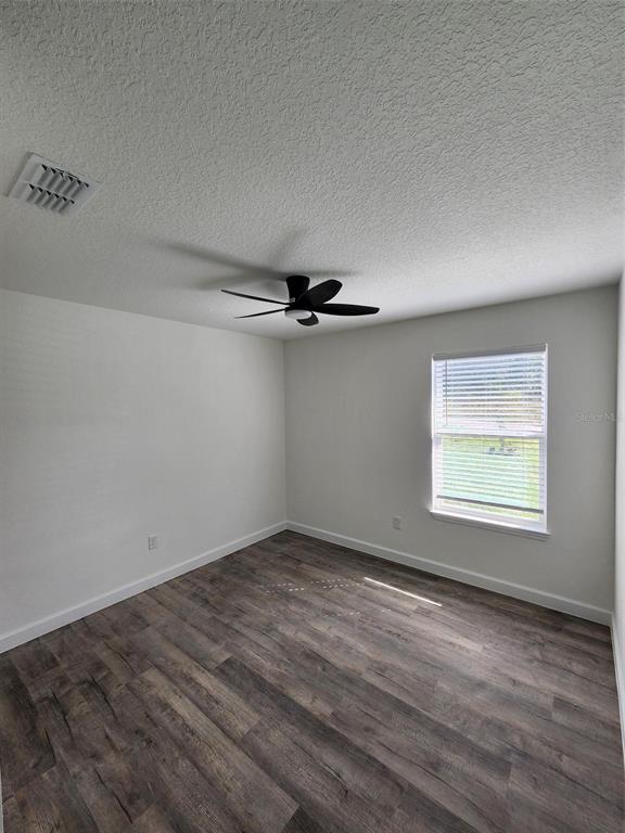 820 Redwood Road Dunnellon, FL 34431 - Photo 14 of 28 an empty room with a empty space and a window