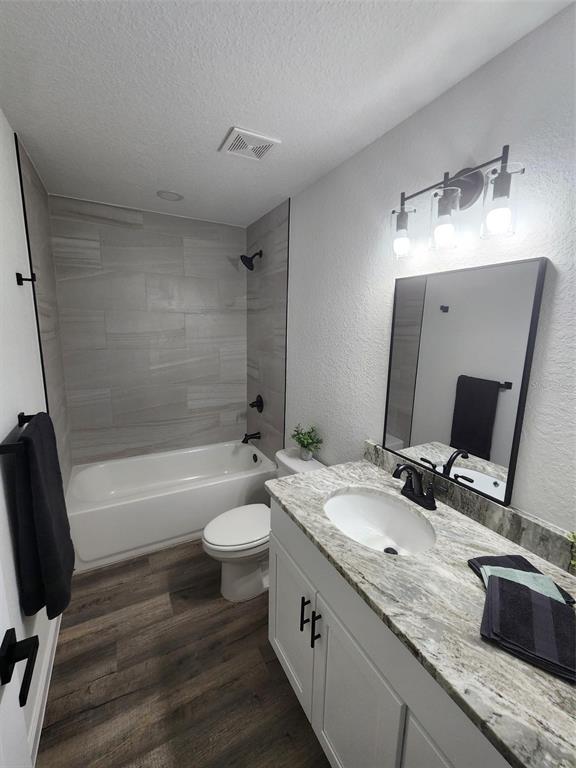 820 Redwood Road Dunnellon, FL 34431 - Photo 15 of 28 a bathroom with a granite countertop sink toilet and shower