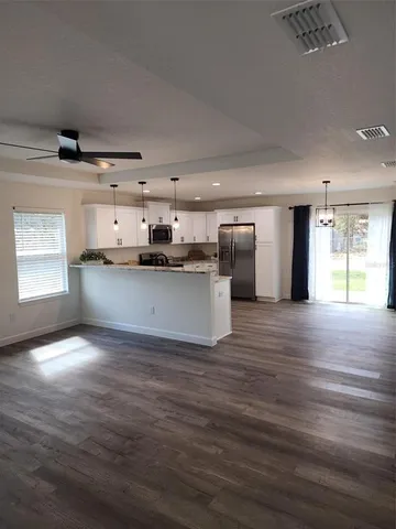 a view of a kitchen with a sink and a window