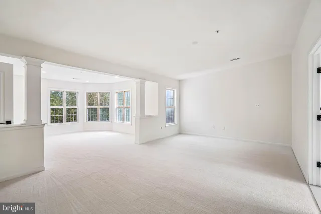 an empty room with windows