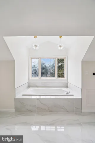 a bathroom with a bathtub and a sink