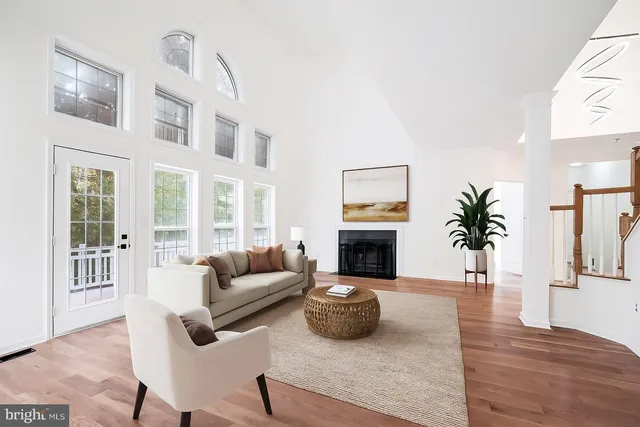 a living room with furniture fireplace and flat screen tv