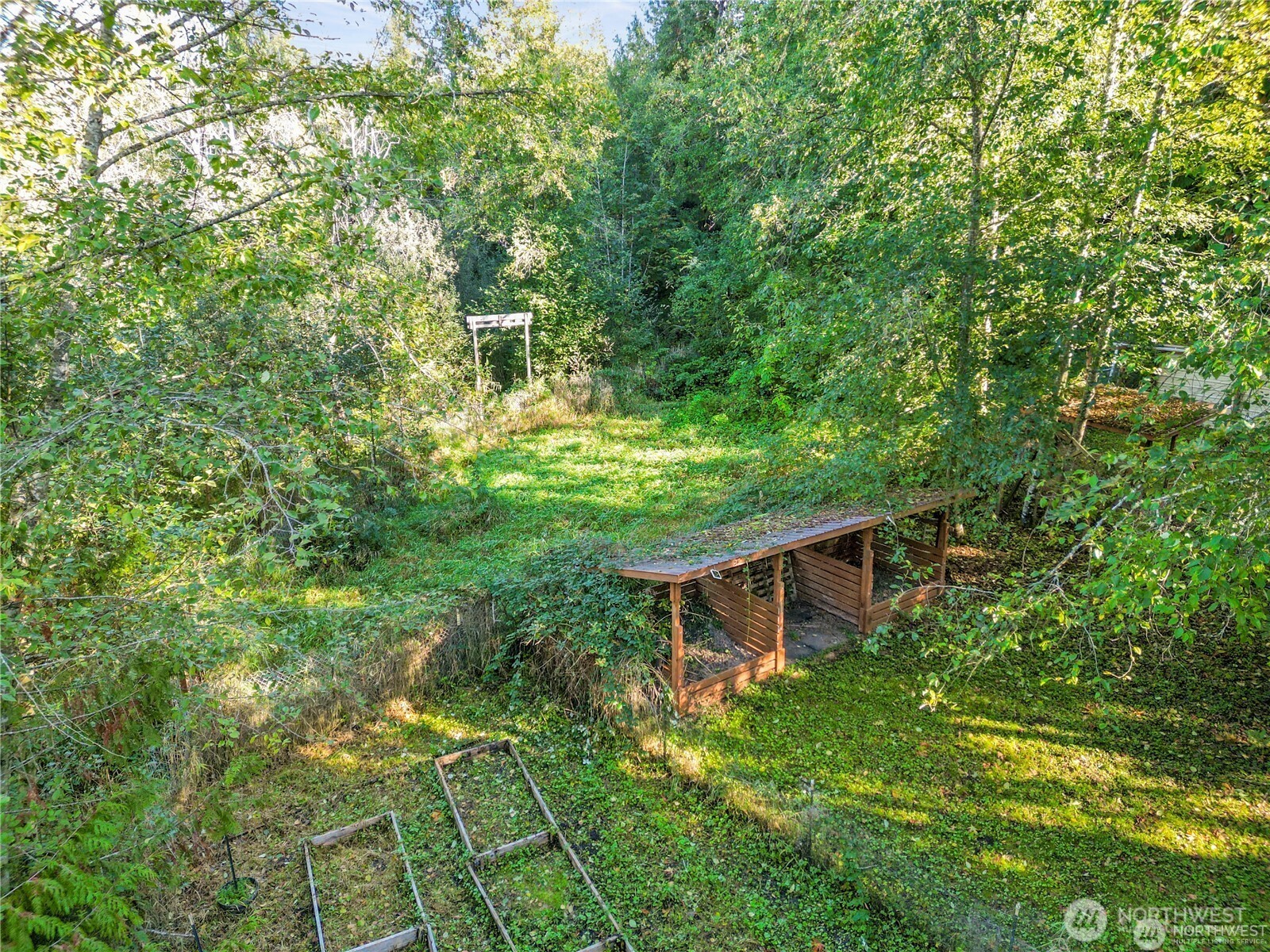 14310 200th Avenue Southeast Renton, WA 98058 - Photo 17 of 39 a backyard of a house with table and chairs