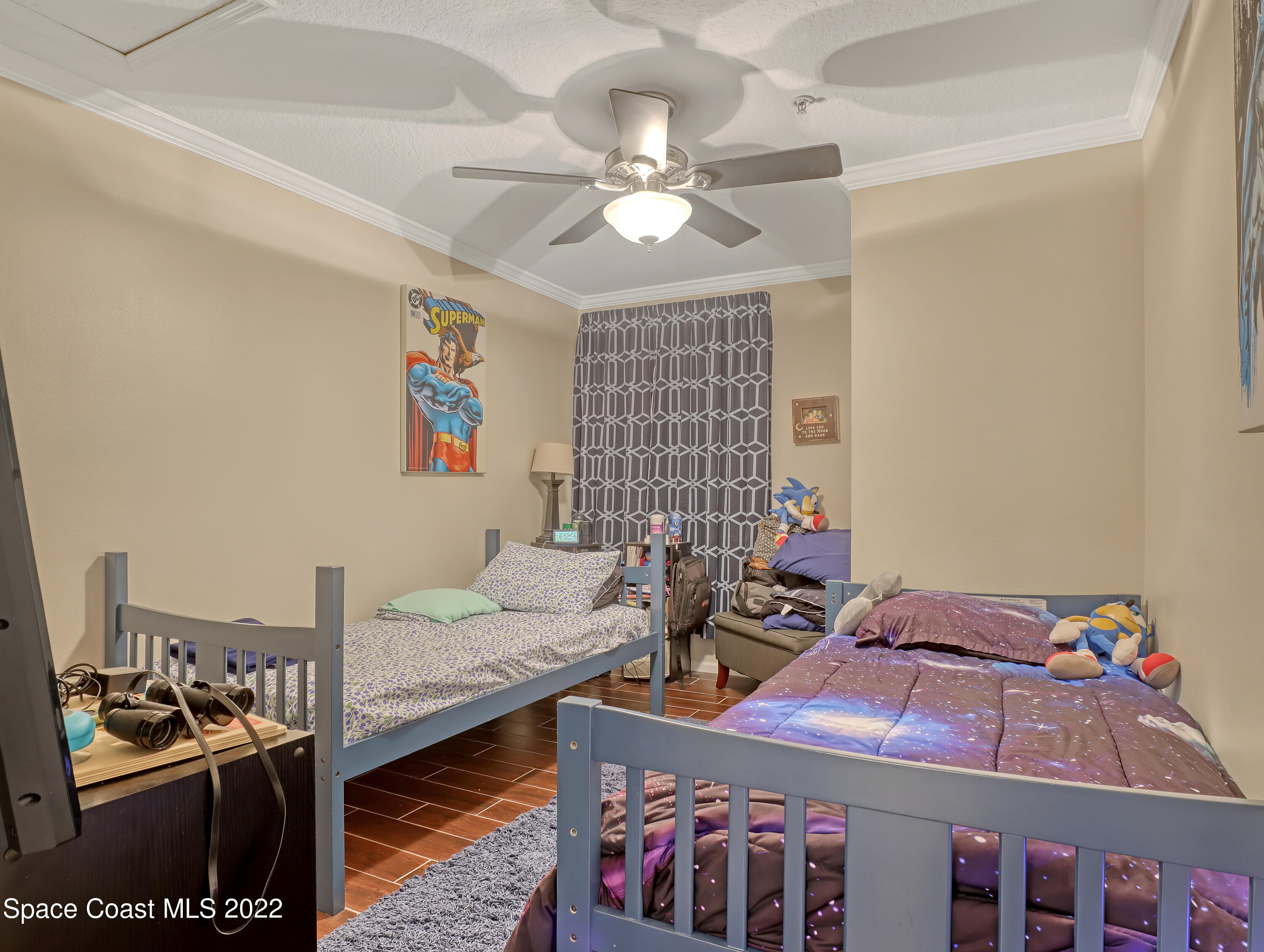 4066 Meander Place, Unit 203 Rockledge, FL 32955 - Photo 16 of 21 a bedroom with furniture and a chandelier
