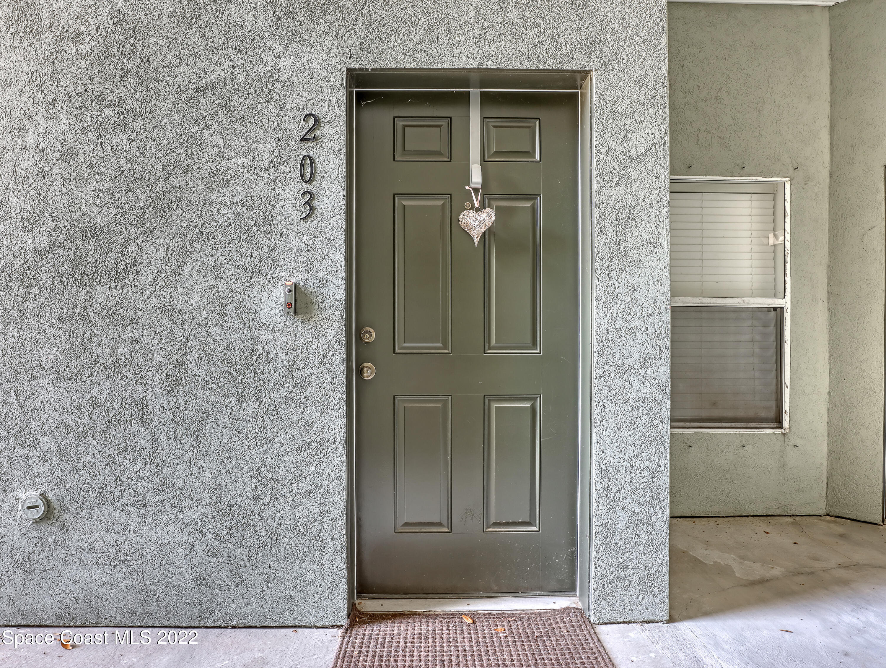 4066 Meander Place, Unit 203 Rockledge, FL 32955 - Photo 4 of 21 hallway view with wooden floor