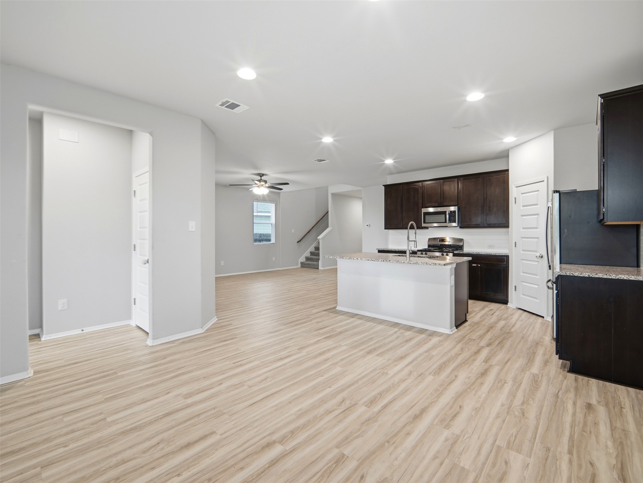 60 Bent Trl Lane Georgetown, TX 78628 - Photo 40 of 40 An open floorplan seamlessly connects the well-appointed kitchen to the spacious living area.