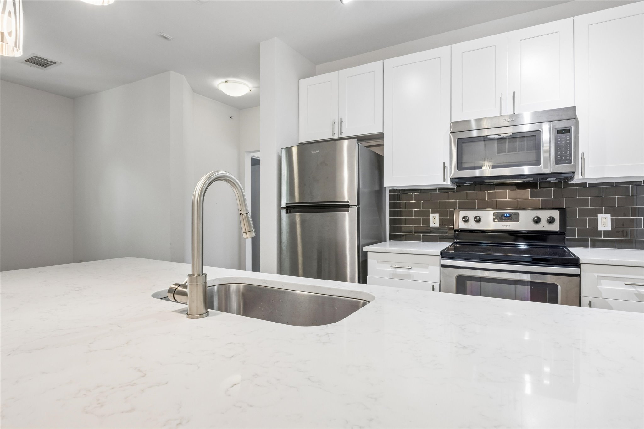 1900 Barton Springs Road, Unit 4041 Austin, TX 78704 - Photo 11 of 35 Culinary delights await in this modern kitchen with stainless steel appliances and abundant counter space.