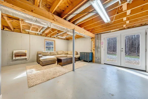a bathroom with a sink mirror and toilet