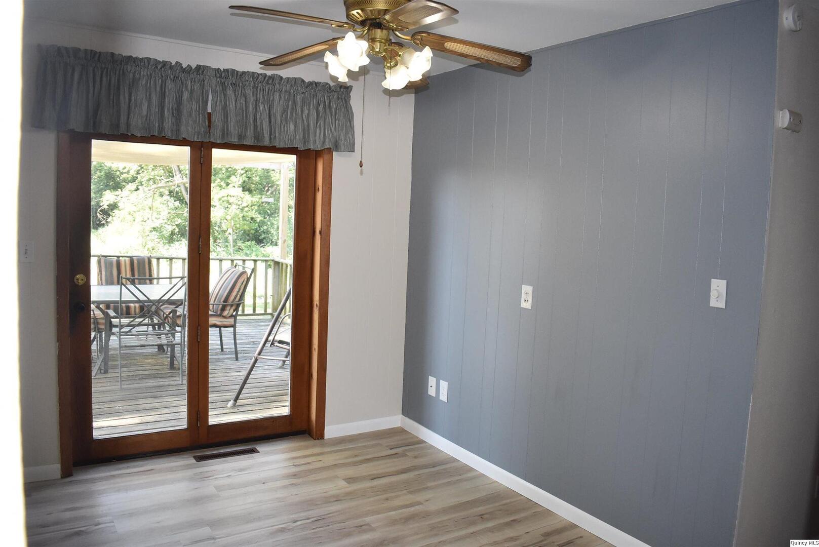 5730 Gardner Expressway Quincy, IL 62305 - Photo 10 of 17 wooden floor in an empty room with a window