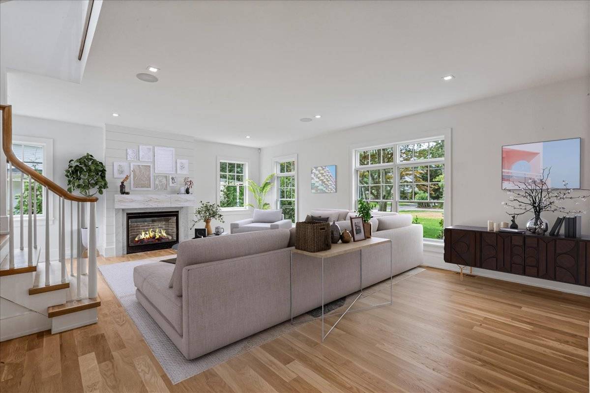 36 Jagger Lane Westhampton, NY 11977 - Photo 11 of 41 a living room with furniture and a fireplace