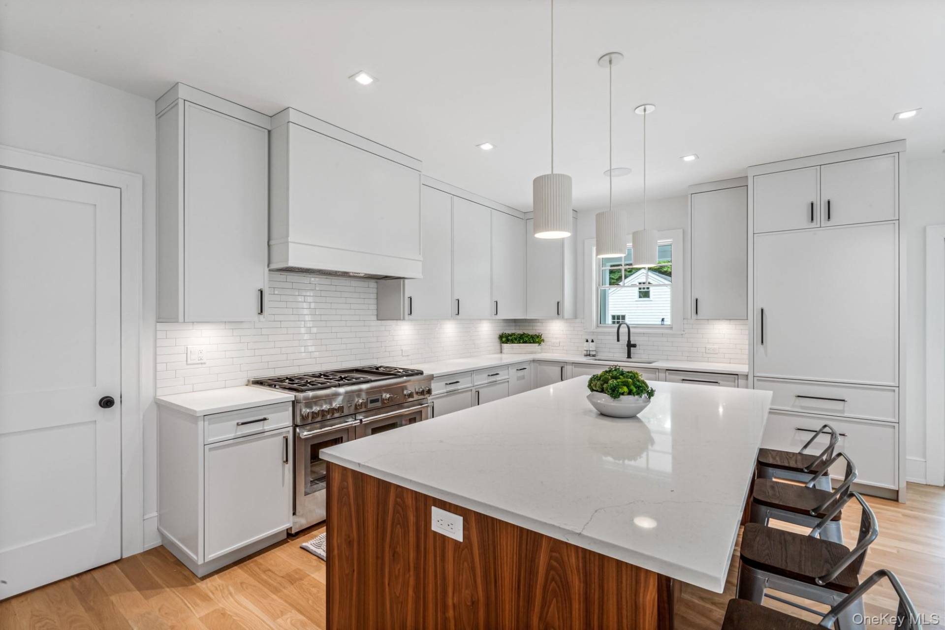 36 Jagger Lane Westhampton, NY 11977 - Photo 15 of 41 a kitchen with a white cabinets and appliances