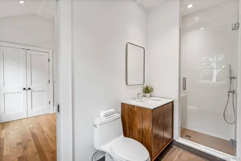 a bathroom with a toilet sink and shower