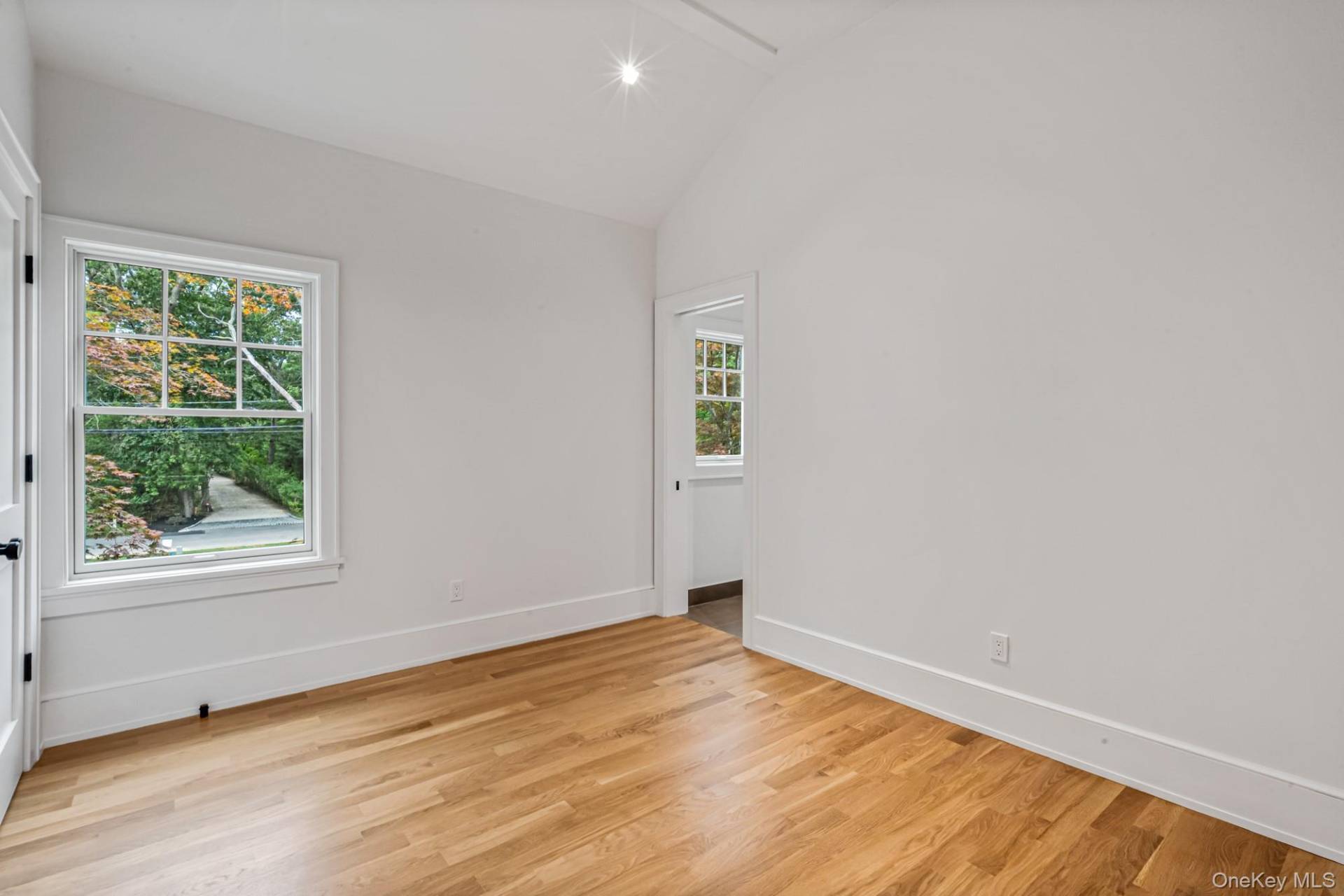 36 Jagger Lane Westhampton, NY 11977 - Photo 27 of 41 an empty room with wooden floor and windows