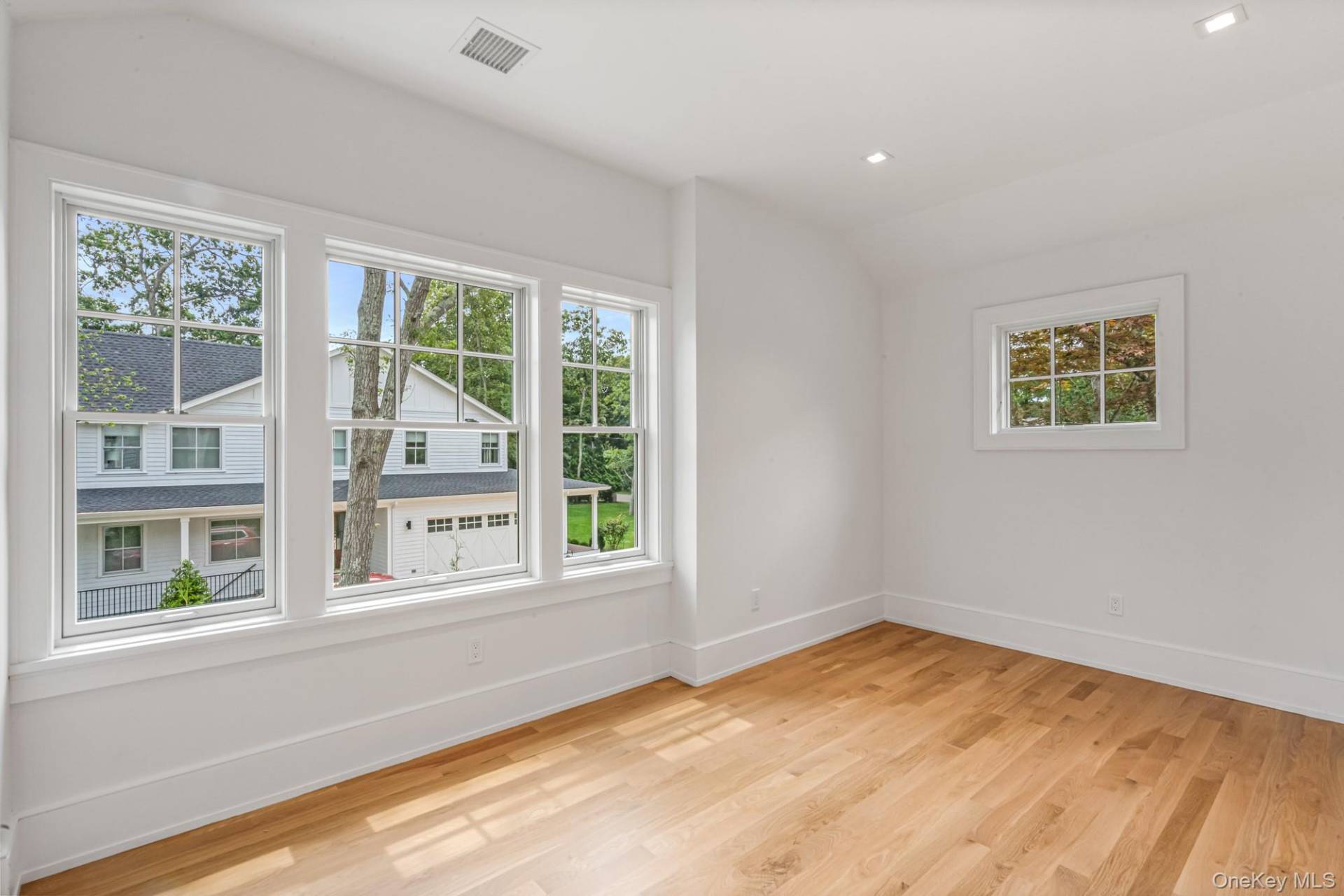 36 Jagger Lane Westhampton, NY 11977 - Photo 29 of 41 a view of empty room with wooden floor and fan