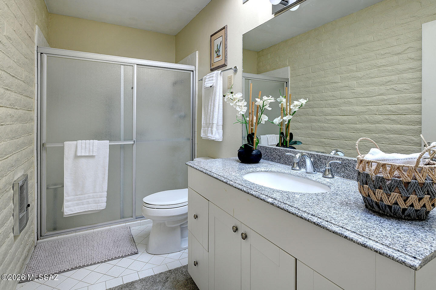 719 West Las Lomitas Road Tucson, AZ 85704 - Photo 28 of 44 a bathroom with a granite countertop toilet sink and mirror