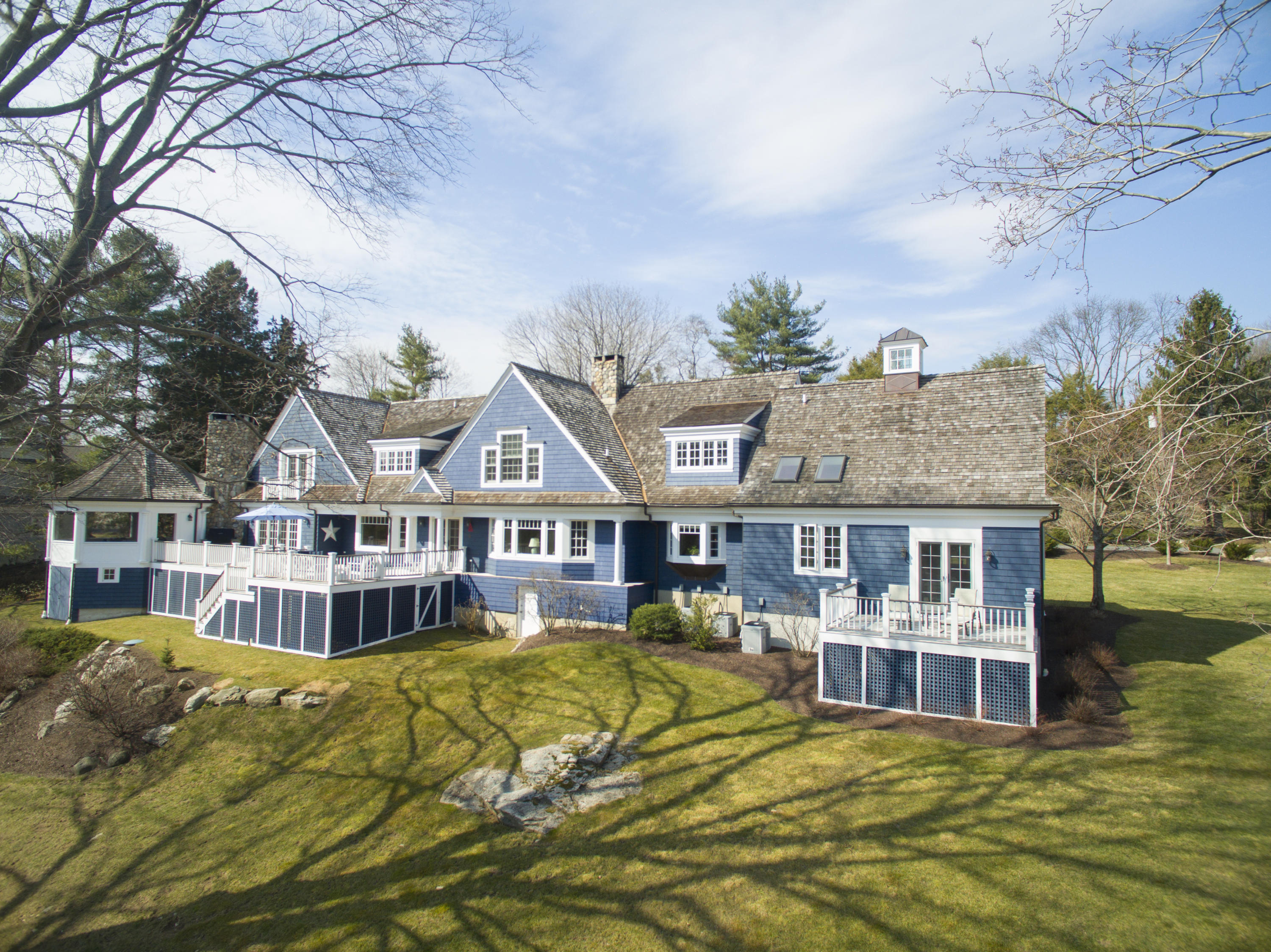11 Juniper Road Darien, CT 06820 - Photo 3 of 25 a view of a house with a big yard and large trees