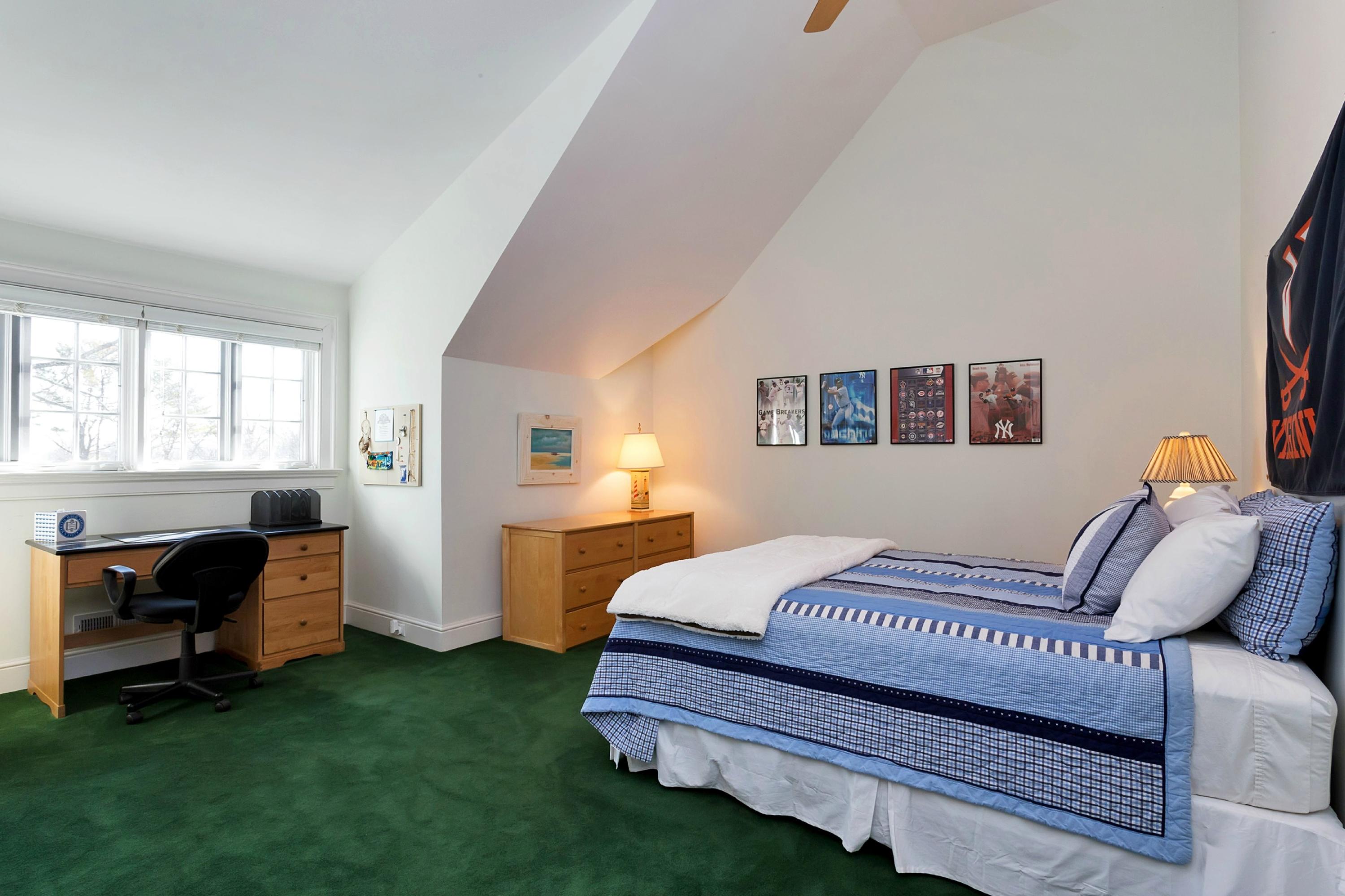 11 Juniper Road Darien, CT 06820 - Photo 21 of 25 a bedroom with a bed and a window