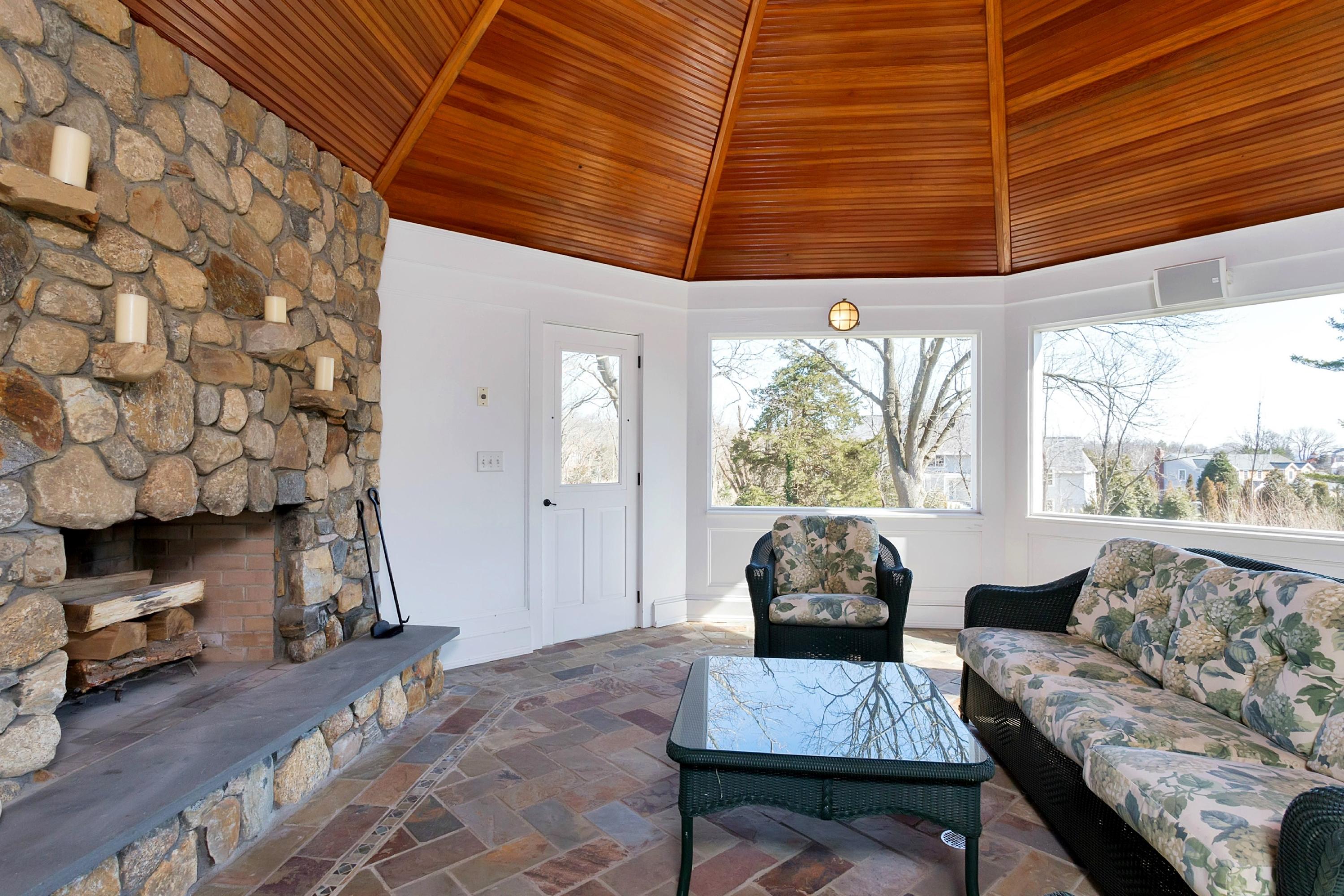 11 Juniper Road Darien, CT 06820 - Photo 23 of 25 a living room with furniture and a fireplace