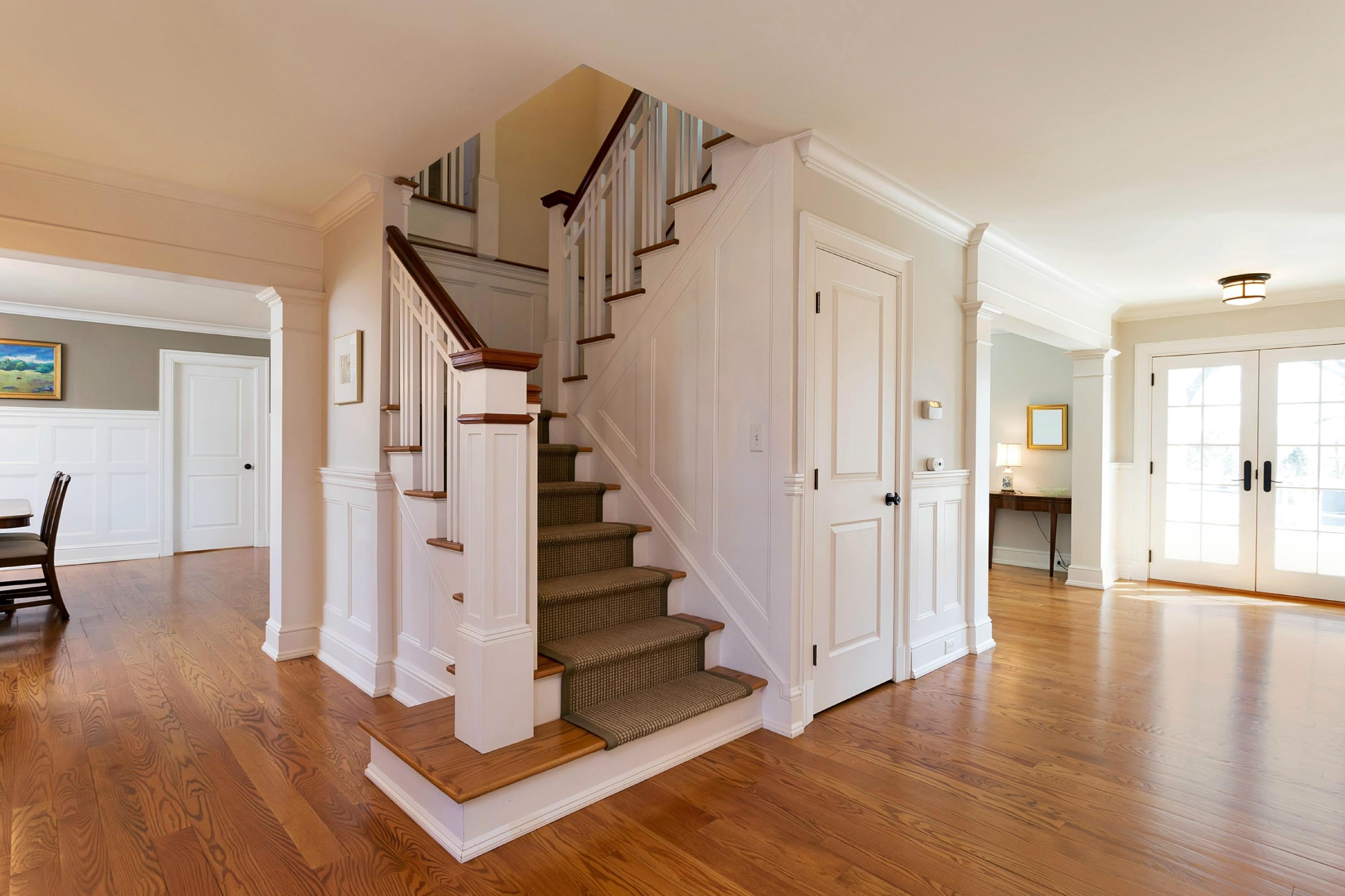 11 Juniper Road Darien, CT 06820 - Photo 4 of 25 a view of a hallway with wooden floor and staircase