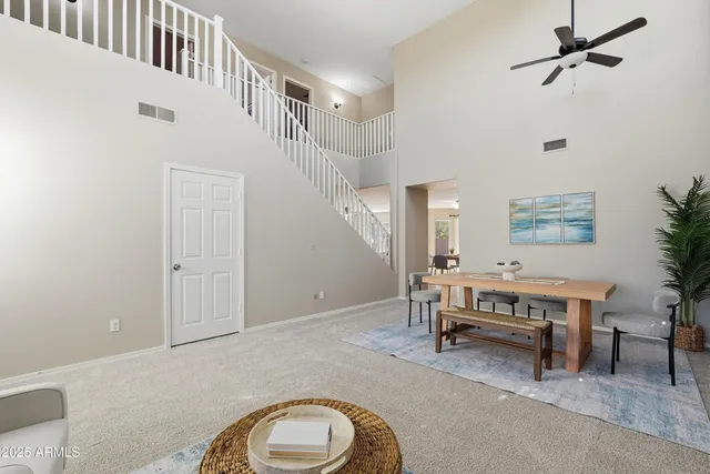 a view of a livingroom with furniture and windows