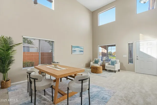 a view of a dining room with furniture and window