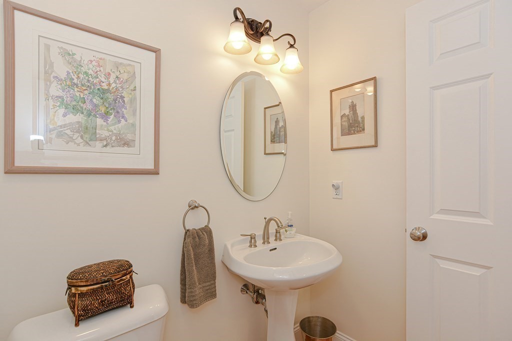 1 Ridgewood Street Ashland, MA 01721 - Photo 12 of 30 a bathroom with a sink and a mirror