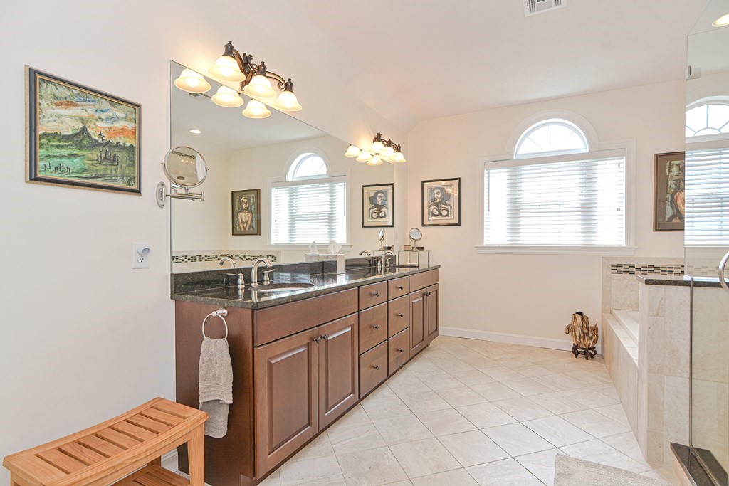 1 Ridgewood Street Ashland, MA 01721 - Photo 17 of 30 a spacious bathroom with a granite countertop sink mirror and a bathtub
