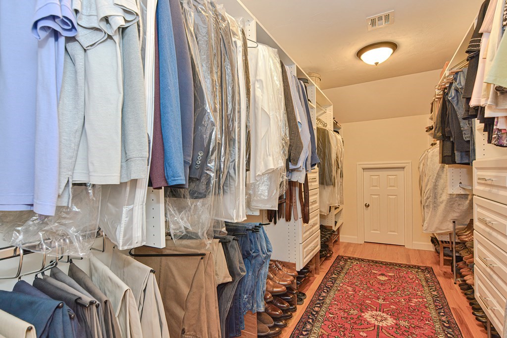 1 Ridgewood Street Ashland, MA 01721 - Photo 18 of 30 a view of walk in closet with clothes and shoes