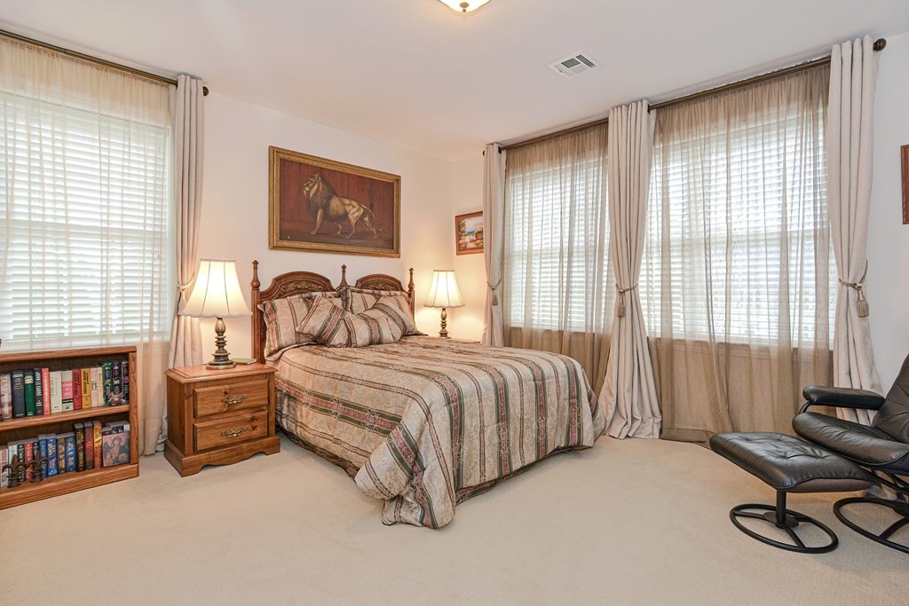 1 Ridgewood Street Ashland, MA 01721 - Photo 19 of 30 a spacious bedroom with a bed and a large window