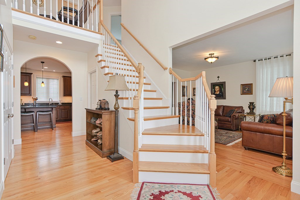 1 Ridgewood Street Ashland, MA 01721 - Photo 2 of 30 a living room with furniture and a fireplace