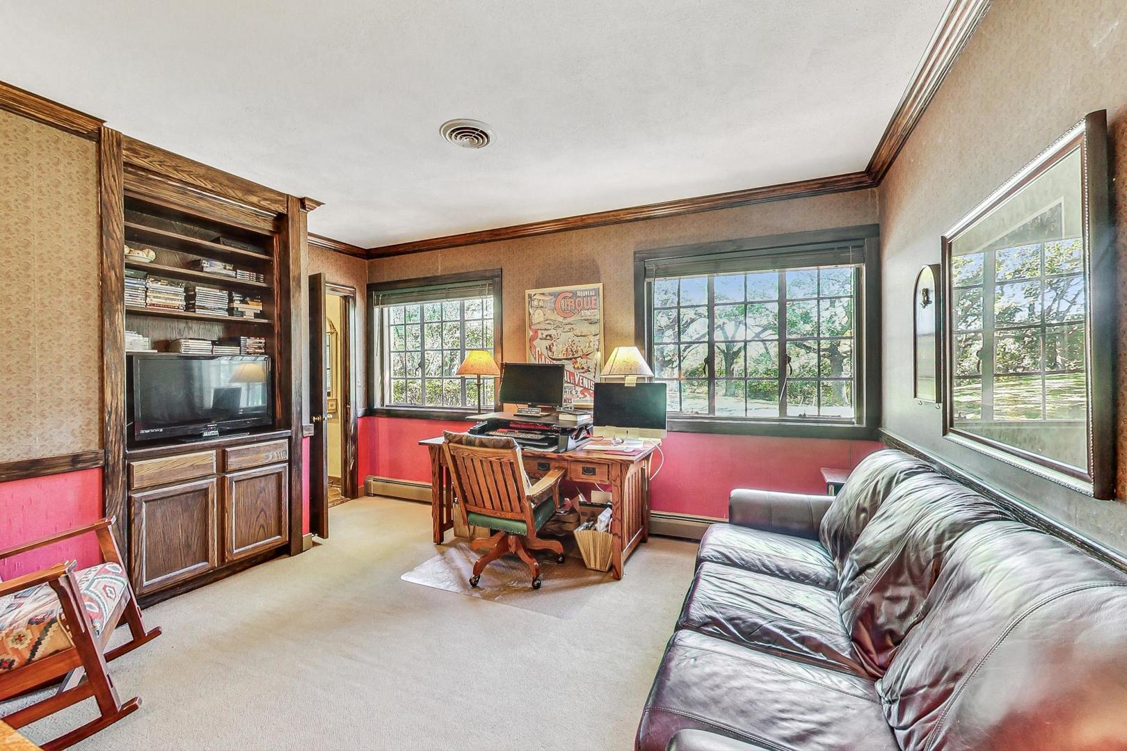 4915 Terra Cotta Road Crystal Lake, IL 60012 - Photo 26 of 93 a living room with furniture and a flat screen tv
